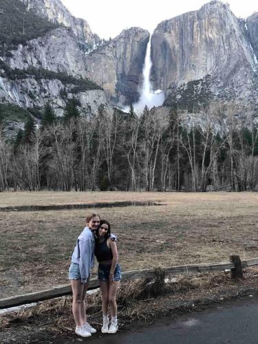 a man and a woman standing in front of a waterfall at Cozy Cub Cabin, brand new home near Yosemite in Mariposa