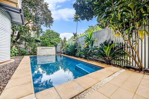 a swimming pool in the backyard of a house at 'Troppo' Darwin Designer Luxury Boutique Home in Paraparap
