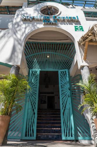 an entrance to a building with a blue door at Sayulita Central Hotel in Sayulita