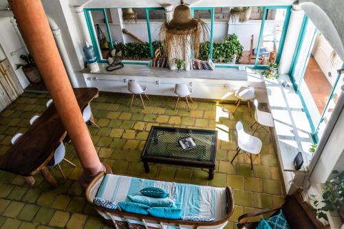 an overhead view of a living room with a table and chairs at Sayulita Central Hotel in Sayulita