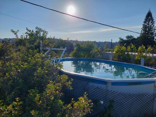 a swimming pool in the backyard of a house at Dream Tiny House or Luxus Tent with pool in Chania Town