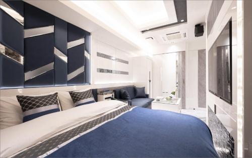 Postel nebo postele na pokoji v ubytování HOTEL KABUKI