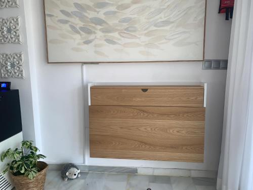 a wooden door on a wall in a room at Casa Hibiscus Marbella in Marbella