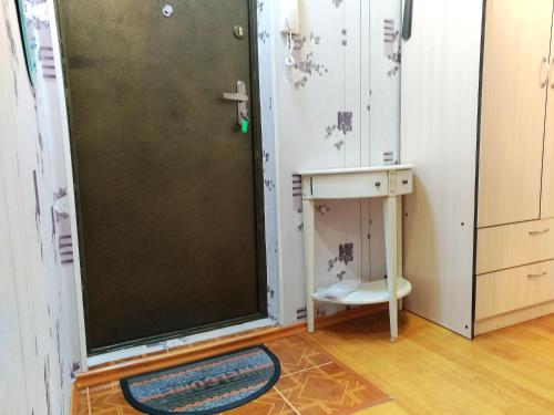 a bathroom with a shower with a door and a table at 429. Отличный вариант для туриста и командированного in Almaty