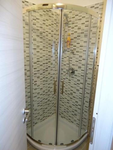 a shower with a glass door in a bathroom at B&B La casa di Giulia in Crotone