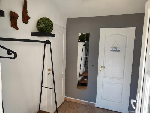 a hallway with a white door and a staircase at Domov Carlotka in Bratislava