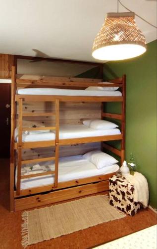 a stack of bunk beds in a room at Appartement cosy cœur de station in Villard-de-Lans