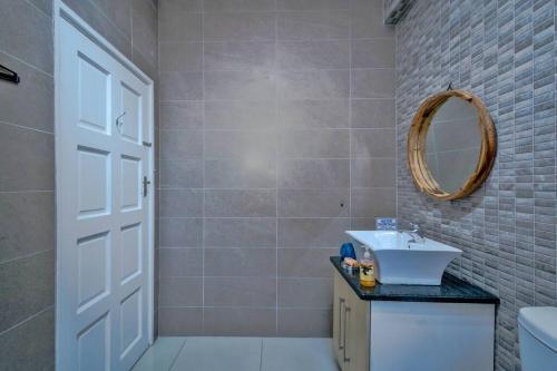 a bathroom with a sink and a mirror at Marlborough apartment 509 in Durban