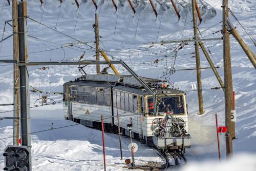 a train on a ski lift in the snow at Le Coucou Hotel Restaurant & Lounge-Bar in Montreux