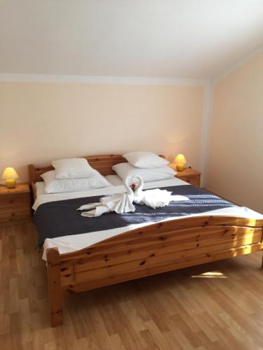 a bedroom with two beds with stuffed animals on it at Pansion Dovodja in Vodice