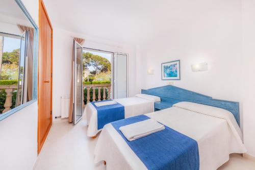 Ένα ή περισσότερα κρεβάτια σε δωμάτιο στο Oro del mar iv apartamento 01