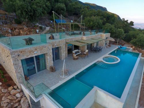 an aerial view of a house with a swimming pool at Summerwine Luxury Villa Sea View Private Pool in Spartýlas