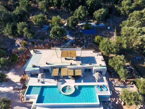 an aerial view of a resort with a swimming pool at Summerwine Luxury Villa Sea View Private Pool in Spartýlas