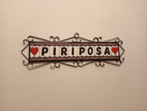 a sign on a wall that reads pilarpora at Mi Piriposa in Valverde