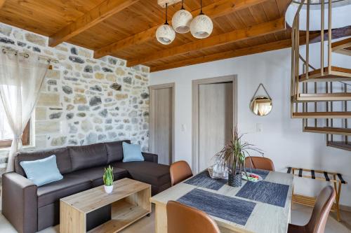 a living room with a couch and a table at Piedra Residence in Pigi