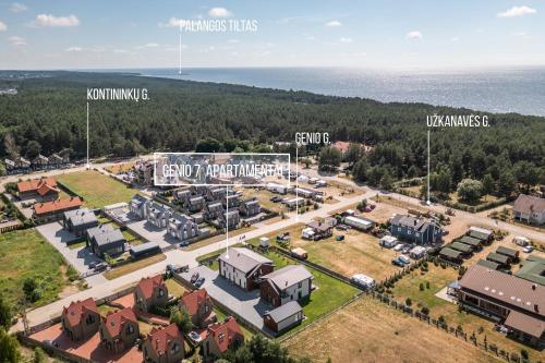 an aerial view of a building with a parking lot at GENIO 7 apartamentai in Palanga