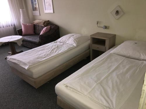 Ένα ή περισσότερα κρεβάτια σε δωμάτιο στο Hotel Quellenhof Bad Urach