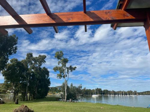 a view of a river with trees and a sky at The Little Cove in Vaal Marina