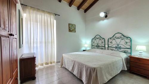 Ένα ή περισσότερα κρεβάτια σε δωμάτιο στο Residenza Le Terrazze Francesca