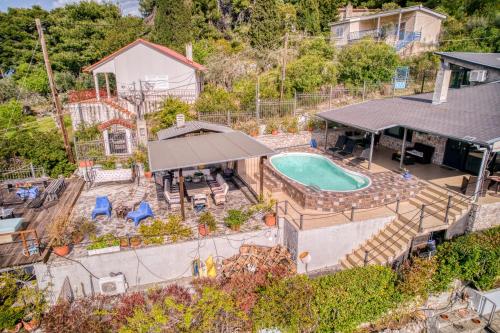 an aerial view of a house with a swimming pool at Magical view, Villa Asproneri, Kamena Vourla in Kamena Vourla