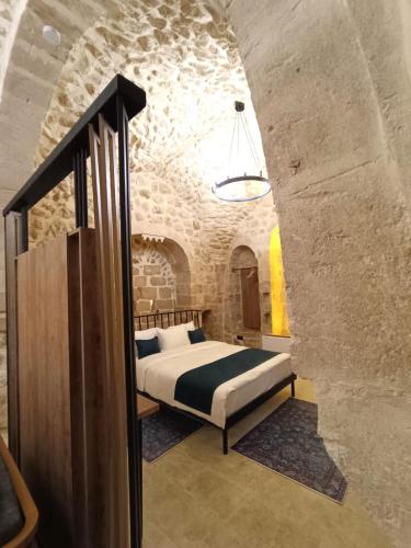 Ένα ή περισσότερα κρεβάτια σε δωμάτιο στο TUĞMANER Small House AJAR