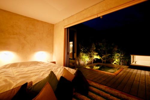 Ένα ή περισσότερα κρεβάτια σε δωμάτιο στο Tara Dakeonsen Kanigoten