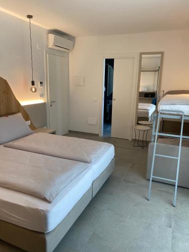 Postel nebo postele na pokoji v ubytování B&B Garda Home