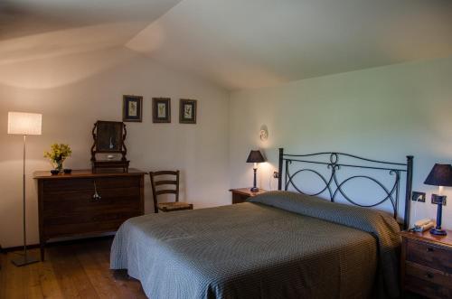 מיטה או מיטות בחדר ב-Le Case dell'Olmo