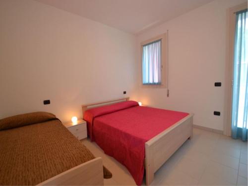 Ένα ή περισσότερα κρεβάτια σε δωμάτιο στο Newly built flat in the heart of Rosolina Mare