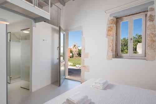 Posteľ alebo postele v izbe v ubytovaní Tholos Cottage