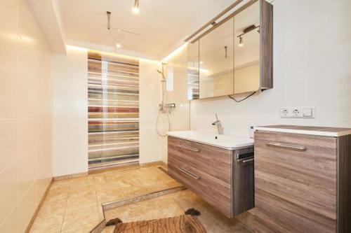 a kitchen with a sink and a counter top at Haus Almrose in Reit im Winkl
