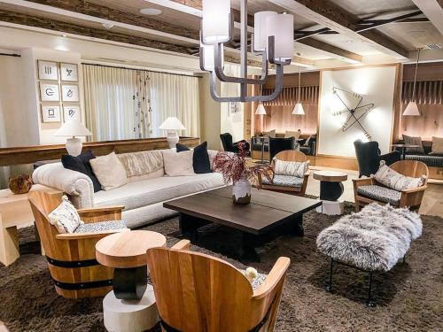a living room with a couch and chairs and a table at Luxury Auberge Madeline Residence Building in Telluride