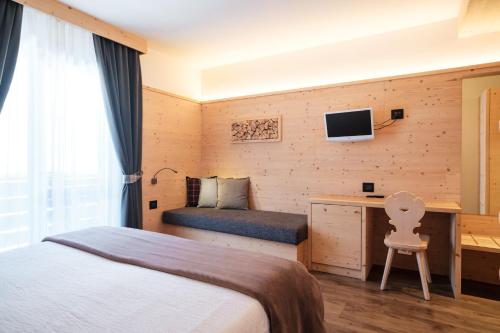 TV a/nebo společenská místnost v ubytování Hotel Piccola Baita