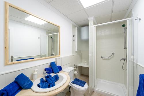 a bathroom with a sink and a shower at Apartamentos Isla de Lobos - Adults Only in Puerto del Carmen