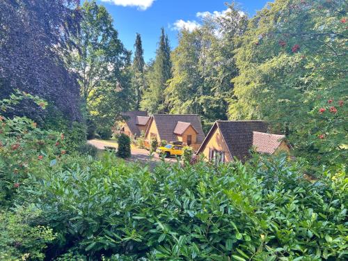 an aerial view of a house in a forest at Ericht Holiday Lodges in Blairgowrie
