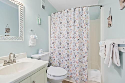 a bathroom with a toilet and a shower curtain at Myrtle Beach Resort A430 in Myrtle Beach