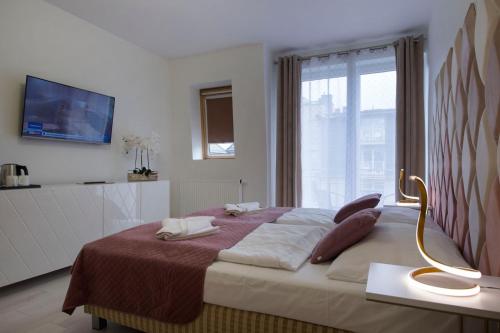 Letto o letti in una camera di Apartamenty Feniks