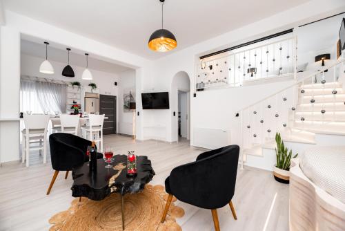 a living room with a table and chairs at Villa Concha Con Perla in Monolithos