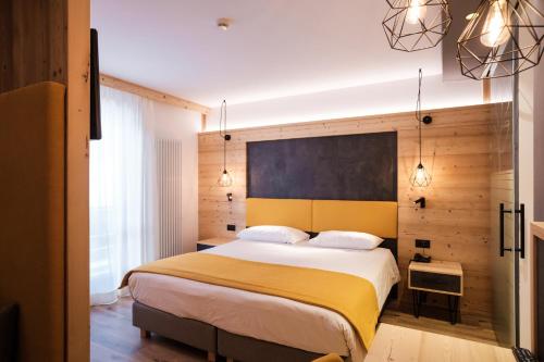 Postel nebo postele na pokoji v ubytování Hotel Piccola Baita