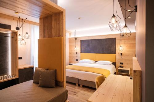 Postel nebo postele na pokoji v ubytování Hotel Piccola Baita