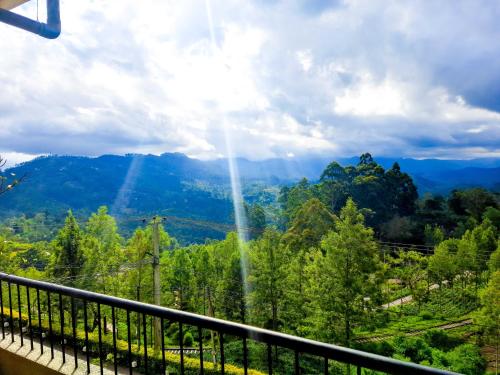 a view of the mountains from a balcony at Awinco Haputale in Haputale