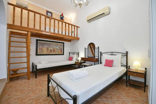 A bed or beds in a room at Maria's House