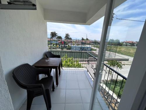 a balcony with a table and chairs and a view at Paradise Boutique hotel in Pamukkale