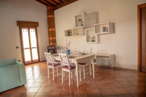 a dining room with a table and chairs at [Sea Garden] Elegant Villa with a View in Rio nellʼElba