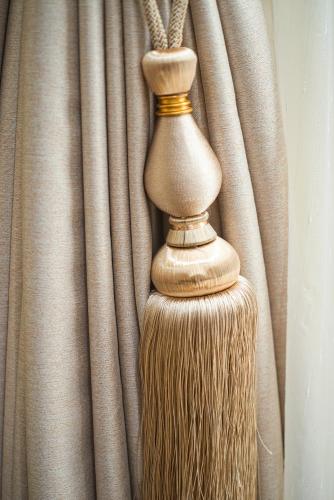 a broom sitting in front of a curtain at Austin David Apartments - Hendon Pad in Hendon