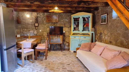 a living room with a couch and a table at Ethno Village Kokorici in Vrgorac