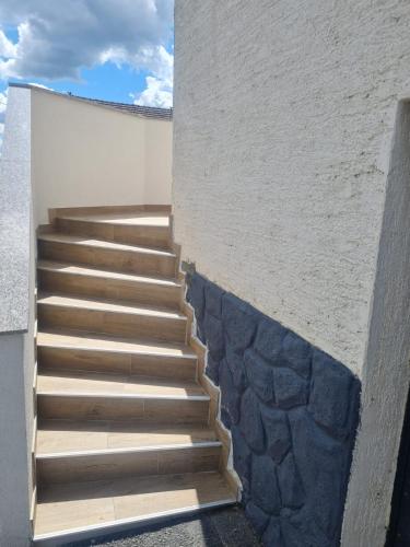 a set of stairs leading up to a building at Apartman Ružić in Sveti Ivan Žabno