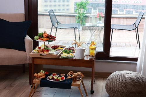 a tray of food on a table in a living room at Nova Plaza Crystal Hotel & Spa in Istanbul