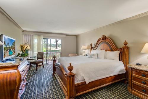a bedroom with a large bed and a desk at Mission Resort and Club in Howey in the Hills