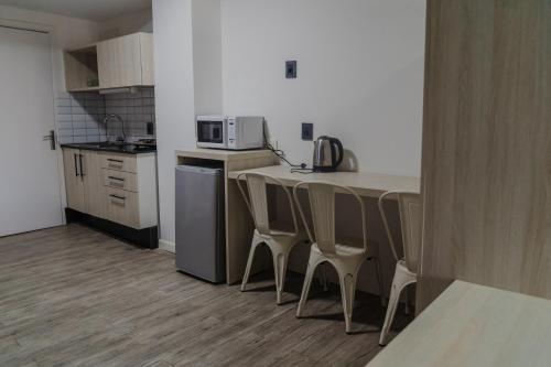 Kuchyň nebo kuchyňský kout v ubytování Quijano Hotel - Aparts & Suites